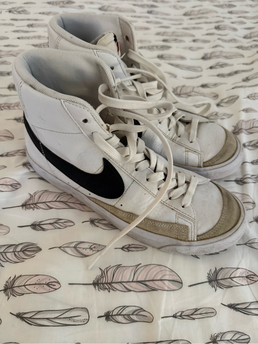 Nike White High-Top Sneakers with Black Swoosh